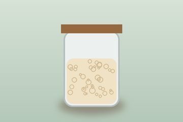 A jar of bubbly sourdough starter